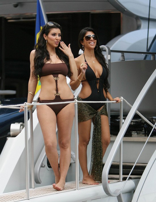 June 12, 2008: Kim Kardashian and sister Kourtney Kardashian have fun in the sun aboard a yacht in Monaco. Credit: Jae Donnelly/INFphoto.com Ref.: infusny-101/usla-102
